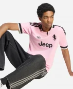 Male model wearing Adidas Juventus 26/27 Away Jersey for Men in pink and black