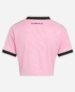 Back view of the Adidas Juventus 26/27 Womens Away Cropped Soccer Shirt featuring true pink polyester fabric, Juventus wordmark, cropped fit, and black trim details.