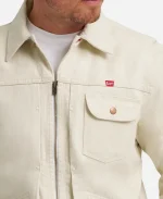 Close-up front view of shirt collar, zipper, and chest pocket with red Banquet label on white cotton jacket.