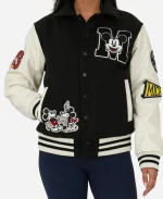 Front view of black Disney Adult Unisex varsity jacket with Mickey Mouse embroidered patches, snap button closure and rib knitted cuffs.