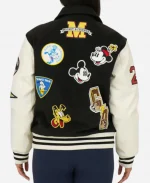 Back view of black Disney varsity jacket displaying Mickey and Friends embroidered patches with varsity styling.